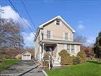 Welcome to 230 Liberty Street! Classic 1920 Colonial style home on over 1/3 acre, with stunning views of Mount Beacon, steps to Beaconâ€™s popular Main Street, The Roundhouse, waterfalls, hiking, restaurants and shops. This sun-filled three bedroom and two full bath home, shows more like a four bedroom, with a den or guest room on the first floor. This charming home boasts new wide plank wood floors and gorgeous replacement windows throughout. A bright and cozy living room with coat closet, opens to chefâ€™s kitchen, with stainless appliances, exposed brick chimney, built in pantry cabinet, open shelving, tile countertops and backsplash, plenty of cabinets for storage, and counter space for prep and entertaining. Kitchen leads to expansive dining room surrounded by windows, with sliders to 8x20 deck, and lovely stone patio, for dining al fresco and taking in the sunsets. Vintage first floor tile bathroom with soaking tub, and timeless vanity. Staircase leads to light-filled landing with large vertical and transom windows. Second floor boasts two generously sized bedrooms (21x13 and 21x11), each with sitting areas, double closets, vaulted ceilings, and windows on three sides. Additional bedroom (9.5x13.5), and full bathroom with soaking tub and separate tile shower completes the second floor. Full basement with laundry, sink, and plenty of storage. Natural gas and central air conditioning, 200 amp electric service and generator hook-up. One car garage with potential for a studio or workshop space. Beautiful home with sprawling lawns on each side of the home, surrounded by Japanese maple, rhododendron, lilac, dogwood, hydrangea and viburnum - with plenty of room for gardening and recreation. Beautiful home!