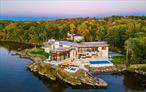Ledgerock, the riverfront masterpiece by modern architect Lee Ledbetter is back on the market after undergoing significant infrastructure improvements.  This one-of-a-kind estate offers the finest Hudson River and Catskill Mountain views on the market today and is set on 5 private acres.  Constructed from the finest materials available, this gorgeous fossilized French limestone & glass compound boasts a 15, 000+/- main residence offering 5 bedrooms and 7.5 bathroom plus a similarly styled guest house offering 3 bedrooms and 2 baths. Ledgerock is one of the very few properties built DIRECTLY on the Hudson River and can never be built again as current set-back laws prohibit building directly on the waterâ€™s edge. Modern lines combined with exotic wood & stone from around the world create a truly unique home designed to entertain both indoors and out. Interior features include a breathtaking, glass-walled great room with a fireplace, a formal dining room, library, billiard room, gym and & massive dine-in kitchen with separate butlerâ€™s pantry. The corner primary suite floats above the Hudson River like a houseboat and features an incomparable spa-like bathroom that includes two large dressing rooms and an office. Outside, there are two levels of travertine decks and terraces that extend from all major rooms offering jaw-dropping river and mountain views. Outdoor features include an infinity-edge saltwater pool, an elevated hot tub, fire-pit, an outdoor kitchen and a covered open-air living room. Updated mechanicals include geothermal heating/cooling, radiant heated stone floors, and state of the art security and ample indoor parking to satisfy a collector. Ledgerock is one of the most extraordinary homes available in the Hudson Valley.