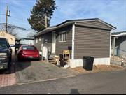 Welcome to this lovely 2-bedroom, 1-bath mobile home in a convenient & friendly community. The spacious living area is perfect for relaxing after a long day. The