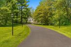 Discover timeless elegance and modern comfort in this 3-bedroom, 3-bathroom colonial-style gem, perfectly situated on a private, park-liKe 1.26 acres in the coveted Putnam Valley community. This home is a true masterpiece, blending timeless charm with contemporary amenities. From the moment you approach, the inviting front deck welcomes you into a beautifully curated space filled with attention to detail. Step inside to an elegant living room featuring a cozy wood-burning fireplace, setting the stage for warm gatherings. The formal dining room boasts a striking beamed ceiling and flows seamlessly into a versatile den, library, or sitting room. This charming space is adorned with pocket French doors and built-in shelving, offering both style and function. Throughout the home, reclaimed wood beams, wide-plank reclaimed wood floors, wrought iron gates from Egypt, and an antique Dutch door from the 1800s create a sense of history and character rarely found. The heart of the home is the expansive open-concept family room and kitchen, designed for both entertaining and everyday living. The kitchen is a chef&rsquo;s dream, featuring oversized subway tiles from Spain, stainless steel appliances, two dishwashers, a wine refrigerator, and a convenient pot filler over the stove. A spacious dining area provides ample room for hosting memorable meals, while the adjacent mudroom and laundry areaâ€”conveniently accessible from the back entryâ€”ensure practicality without compromising style. Upstairs, the home continues to impress. The bathrooms have been thoughtfully updated. The master suite offers a private retreat with barnwood-beamed ceilings and is complete with its own balconyâ€”a perfect spot to savor morning coffee or unwind under the stars. Outside, the beautifully designed backyard stone patio is ideal for outdoor dining, barbecues, and entertaining. With appliances less than two years old, the driveway two years old and a roof just five years old, this home offers worry-free living. Conveniently located near schools, shopping, dining, entertainment, hiking trails, and wine trails, and just an hourâ€™s train ride to NYC via Metro-North, this property truly combines the best of tranquility and accessibility. Donâ€™t miss the opportunity to call this one-of-a-kind home yours!