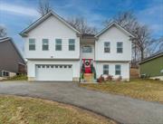 Gorgeous 2020 built home that looks like BRAND NEW! Experience the charm of country living but village feel in this gorgeous raised ranch, centrally located in Maybrook, New York. This inviting home features an open concept living space, perfect for modern living and entertaining. Upon entering this home, you will feel the attention that was given to it by these owners. Beautiful upgraded hardwood flooring gleems throughout this home. Entire home was just professionally painted last month! The kitchen has exquisite granite countertops, stainless steel appliances, tile backsplash, and an eating counter. Your dining area is there too with sliding doors going out to your deck and patio paved area complete with a hot tub that is a year old! And...it stays! The living room area is spacious with natural light coming through the large windows and the mountains can be seen in the distance. On this main floor, you will find the master suite with his and her closets and a newly upgraded master bathroom. Two more spacious bedrooms are on this floor as well along with another full bathroom. And, it gets better! Downstairs is completely finished with new LVP flooring! Another living area is ready for you to create your fun. A walled off room could be perfect for an office or a 4th bedroom! A full bathroom is in this area as well! An in-law suite would work beautifully in this space as well, and it has its own entrance. Home is only minutes from I84 and the NYS Thruway. 60 miles to NYC. Close to all restaurants, malls, wineries, hiking trails, the Shawangunk mountains, and the Newburgh waterfront. Schedule your showing today! Once you see this home, you will fall in love.