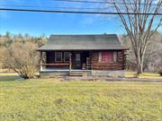 For those who believe a house isn&rsquo;t a home unless it&rsquo;s a log home, this property is for you! Nestled on four picturesque acres, this authentic log home offers warmth and character just minutes from the town of Catskill. The open living room flows seamlessly into the eat-in kitchen, complete with a cozy heat stove for chilly evenings. Featuring three bedrooms, hardwood floors, and a partially finished walk-out basement perfect for gatherings, or additional space to relax. This home combines charm and functionality. Start your mornings on the front porch or side deck overlooking the spring- fed pond. The property also includes a detached two-car garage and plenty of room to enjoy the outdoors. Don&rsquo;t miss this perfect log home with lake views and timeless appeal!