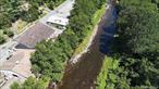 Callicoon, New York - 5 acre commercial property with 1400 feet of stream front on the Callicoon Creek. Located on NYS RT 17B and next to NYS Rt 97, this is a high traffic/highly visible location. The access for trucks and vehicular traffic is level and provides easy access for loading, unloading and doing business. Currently used as an automotive repair facility, it consists of 4 buildings, large parking area. Main building is 20, 000+/- SF consisting of 3 furnaces, 3 phase electric, 5 lifts. 16&rsquo; high ceilings-many large overhead doors, 2 large garage service areas, body shop with spray booth, lobby entrance, plus many office rooms on 1st & 2nd floor. Building 2 is the tire storage shed (108x45), Building 3 is the vehicle storage garage (45x102), Building 4 is 24x45 and is used for storage. Great level location, 1400 ft on NYS Route 17B and at the intersection of NYS Route 97 - a high traffic location. Let your imagination be your guide, from automotive and industrial to retail sales. This is the gateway to Pennsylvania and the bustling Hamlet of Callicoon on the Delaware River.