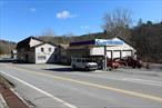 Automotive garage known as Roche&rsquo;s Garage in Callicoon. Consisting of 4 buildings, large parking area. All set on 5 acres with 1400&rsquo; on Callicoon Creek frontage. Main building is 20, 000+/- SF consisting of 3 furnaces, 3 phase electric, 5 lifts. 16&rsquo; high ceilings-many large overhead doors, 2 large garage service areas, body shop with spray booth, lobby entrance, plus many office rooms on 1st & 2nd floor. Storage areas for 1000&rsquo;s of automotive parts from basement to attic. Building 2 is the tire storage shed (108x45), Building 3 is the vehicle storage garage (45x102), Building 4 is 24x45 and is used for storage. Great level location, 1400 ft on NYS Route 17B and intersection of NYS Route 97, a high traffic location. Let your imagination be your guide, from automotive and industrial to retail sales. This is the gateway to Pennsylvania and the bustling Hamlet of Callicoon on the Delaware River. Additional Information: Heating Fuel:Oil Above Ground, ParkingFeatures:4+ Car Attached, 4+ Car Detached,