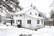 This Colonial/Cape home, gracefully nestled on an acre of land right in New City. In addition to its natural beauty, it boasts extra bonus rooms for play, relaxation and work. The bedroom areas on the second floor offers its own unique character. There are 3 full bathrooms, recently updated, washer/dryer area off kitchen. Updated kitchen with quartz countertops, two sinks, microwave, refrigerator and oven/stove. Enjoy the covered porch/sun room on any day! Home is being sold as-is.