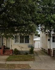 2-family house with a Full- Full-finished basement with a separate entrance. sold AS IS. Walking distance to the A train and buses, a short drive to JFK airport, and blocks away from Belt Pkwy. Near Stores and restaurants. The house is well maintained, windows on the second and most of the first floor windows were replaced about 3 years ago. The new Boiler and Water heater are under 2 years old. Garage Needs TLC. The outside sewer line was replaced around 3 years ago. Each apartment has its own electric meter. Wooden Floors in all the rooms.  The house is semi-detached and has a shared driveway with access to park on the back or inside the Garage.