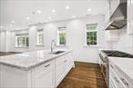Enjoy luxury living in this spacious two-bed, two-and-a-half bath Condo in Scarsdaleâ€™s premier building. This home boasts an open floor plan, high-end finishes, and elegant details. The foyer leads to the custom chefâ€™s kitchen, featuring Thermador appliances and large island, living room, with gas fireplace, and dining area. The primary suite is a sanctuary with a spa-like bath with a soaking tub, and walk-in closets by California Closets. The 2nd bedroom includes an en-suite bath and walk in closet. A powder room and laundry room complete the layout. Additional features include hardwood floors, pre-wiring for in-wall speakers, two assigned indoor parking spaces, and a storage room. The building offers amenities such as a fitness center, EV car charging, and doorman. Located at Five Corners, The Heathcote combines boutique luxury with easy access to Scarsdaleâ€™s best shopping and dining. This pet-friendly apartment is a unique opportunity for stylish living. Photos are of model unit.