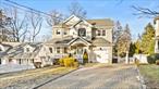 Welcome to this elegant Victorian home walking distance to vibrant Huntington Village and Long Island Rail Road. Built in 2005, this architectural charmer with street presence welcomes you through a lovely covered porch into an open foyer that puts the grandeur of this home immediately on display. Entertainers first floor with open plan, chefs kitchen with sun drenched breakfast nook and bay window, vaulted 2 story living room with wood burning fireplace and second story balcony. Formal dining and living room, laundry center, and interior access to garage. The upstairs living quarters has 4 bedrooms and 2 full baths including the primary en-suite with WIC and grand bath. Finished lower level with walkout offers a large open rec area, full bath, and bedroom with egress. Enjoy the fully fenced property with mature landscaping and gazebo from the oversized deck accessible to living room. Natural gas, sewers, central air and vac, are some of the features that make this home a must see!