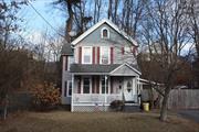 Nestled in the heart of Port Jervis is this 3 bedroom home with a welcoming rocking chair porch to just relax an maybe watch beautiful warm day sunsets. The home features hardwood floors in the living and dining rooms, laminate in the kitchen and carpet in the bedrooms. The dining room has a set up for a wood stove with a newer chimney is in place  The home features a living room,  dining room, laundry/pantry and kitchen on the first floor, the three bedrooms and bath on the second floor, and a full size attic for storage. A new heating system has just been installed. The driveway leads up to the enclosed side porch and a storage shed and there is a privacy fence gate that can be left opened or closed. The home is located close to area amenities such recreation parks for hiking, biking and sports, the area rivers for fishing and rafting, schools, shopping, restaurants,  services and NYC trains.