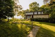 Located less than 5 minutes from the center of Rhinebeck Village find this preserved Mid-Century home perched on 49 acres of land with incredible sunset views over the Hudson River and Catskill Mountains. Built in 1970, the 4 bedroom, 2 and a half bath home has original wood floors throughout and a wood burning fireplace in the living room surrounded by windows and sliding glass doors bathing the home with light and incredible views. The main floor has an office, living room, dining room, kitchen, pantry and half bath. The second floor has a primary suite, 3 additional bedrooms and the second full bath. The two car garage is attached and directly accessible through the kitchen. Extensive site work has been done on the property. The views have been opened up, removing old trees and canopying others. The driveway has been graded and trenched to prevent wash out. Sub-division has been conditionally approved by the Town of Rhinebeck. Less than 2 hours to NYC, easy access to Amtrak and all of the amenities of the Hudson Valley. Additional Information: HeatingFuel:Oil Above Ground, ParkingFeatures:2 Car Attached,