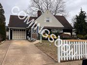 Step into this spacious 4-bedroom, 1.5-bath, 1, 290-square-foot expanded ranch in Levittown! The first floor features a welcoming vestibule entrance leading to an eat-in kitchen with a dishwasher, a formal dining/living room with a wood-burning fireplace, and a den/family room with wall AC and a closet. The extended master bedroom offers a large closet, while an additional bedroom doubles as a home office. A bright rear sunroom with two skylights, a tiled full bathroom, and ample living space complete the main level. Upstairs, youâ€™ll find a large bedroom with wall AC, storage eaves, and overhead lighting, a second bedroom with a closet, a half bathroom, and a large unfinished attic. Additional features include updated windows, a new 275-gallon above-ground oil tank, a 14-year-old boiler with 2-zone heating, a 1.5-car garage with a separate laundry room, and a private fenced backyard with PVC fencing and a shed.