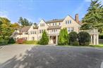 This exquisite English manor-inspired residence embodies timeless sophistication with sprawling designer interiors and over an acre of private, park-like grounds. Featuring a pool and tennis court, this is an ideal destination for work and play in one of Scarsdaleâ€™s most coveted estate districts. Completely gut renovated and redesigned in 2009 by renowned Rosamund A. Young Architecture and Cum Laude Group, this over 10, 000-square-foot home impresses with a thoughtful indoor-outdoor layout equally suited to lavish entertaining and peaceful relaxation. Stately interiors boast rich hardwood floors, tall ceilings, designer lighting, and handsome millwork, including wainscoting and substantial window and door casings. Built-in speakers and a generator nod to the homeâ€™s attention to detail.A gracious foyer introduces the classic center hall layout. To the right, the nearly 30-foot-long living room features a fireplace and French doors opening to a covered patio. Ahead of the entry, a sunroom and family room with fireplace invite relaxed gatherings, while the formal dining room awaits your next dinner party. A convenient butlerâ€™s pantry with a sink and wine refrigerator ushers you into a showstopping gourmet kitchen filled with custom cabinetry and thick slab countertops.The fleet of upscale stainless steel appliances includes a Wolf six-burner range with double ovens, wall oven, built-in microwave, warming drawer, dishwasher, large refrigerator and separate freezer. The massive center island/bar counter and sunny breakfast room provide plenty of room for casual meals, while French doors offer seamless access to the primary patio. Past the kitchen, the thoughtfully designed mudroom wing includes a custom cloakroom, walk-in closet, full guest bathroom, and access to another patio. Ascend the graceful grand staircase to the second-floor bedroom level, beginning with the luxurious ownerâ€™s retreat. The king-size primary bedroom is surrounded by a sitting area, fireplace, and a spectacular private deck. The en suite spa bathroom boasts an oversized soaking tub, walk-in shower for two, double vanity and private water closet trimmed in dark woodwork and swaths of marble. Ahead, the massive dressing room features floor-to-ceiling shelving and a packing island. Two expansive secondary suites enjoy treetop outlooks, roomy closets, private bathrooms and easy access to a vaulted recreation room that could also be used as additional bedrooms with a full bath. A laundry room, walk-in storage room and sun-kissed home office add convenience to this level. On the top floor, discover an extra-large executive office with built-ins and a fireplace, another bedroom suite, a full bath, a home gym and more storage. Fun awaits on the finished lower level, where youâ€™ll find a sprawling rec room, billiards room and media room bordered by a convenient wet bar and wine cellar. A second laundry room, abundant storage and a nanny suite are also on this level. Outside, the verdant 1.19-acre grounds make outdoor enjoyment irresistible with mature landscaping, including towering trees and hedges that create complete privacy. Host lively barbecues and gameday gatherings, take a dip in the large covered swimming pool, or improve your backhand on your private tennis court. A circular drive, motor court and attached three-car garage add plenty of parking to this exceptional Scarsdale showplace. Coveted Morris Lane is known for its stunning estate properties. While it feels worlds away, this lovely neighborhood is minutes from Scarsdaleâ€™s best shopping, dining and golf, with easy access to parkways, Metro-North stations and top-rated schools. Additional Information: Amenities:Tennis, ParkingFeatures:3 Car Attached,