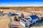 One of a kind equestrian property in the heart of Orange County NY. This impressive custom built 3869 sf mini estate colonial home set on 35.7 pristine acres features a large chef inspired kitchen with cherry wood cabinets, walk in pantry, wine cooler, stainless steel appliances, and granite counter tops. The bedrooms are oversized with a primary suite with closets galore and jacuzzi tub, a bonus room on the upper level adds additional space. Radiant heated flooring provides warmth through out the lower level and a library with built in book shelves is perfect for a home office. The laundry room includes a shower where your four legged pets can have a spa after a long day of outdoor activity. The 2592 sf pole barn is equipped with 9 12 x 12 padded horse stalls, tack room, feed room, wet stall, and a walk up loft. There are 5 fenced in paddocks with water spigots and a 80 x 100 outdoor ring for on site riding. Additional outbuildings include a 960 sf barn that can add additional stalls, a 4 car detached garage/equipment shed in addition to the 3 car attached garage all adds additional space to the property.