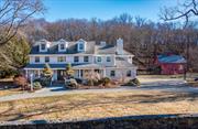 An incredible opportunity awaits atop Quaker Hill. Set on a park-like 1.34-acre parcel framed by picturesque stone walls, this custom-built colonial spans 4, 615 SF over three floors. The home is complemented by a stunning 24 x 36 two-story post-and-beam barn, a serene pond, raised garden beds, and expansive outdoor spaces. The home&rsquo;s design is incredibly functional, with a flexible floor plan that accommodates both formal and casual living, generously proportioned rooms and two primary suites. The first floor, encompassing 1, 795 SF, features a dramatic two-story foyer flanked by formal living and dining rooms. The heart of the home features an open-concept kitchen, breakfast area, and family room, highlighted by a large brick wood-burning fireplace and French doors leading to a spacious back deck. The first-floor primary suite boasts French doors to the deck, a deep closet, and an en-suite bath. Completing this level are a powder room, laundry room with access to the front porch, pantry, and a convenient back staircase leading to the library/den. Access to the heated three-car garage adds to the homeâ€™s ease of functionality. The second floor, spanning 1, 924 SF, hosts a second primary suite with a walk-in closet, a large en-suite bath, a sitting room, and access to the impressive 552 SF library/den. This remarkable space showcases walls of windows, a wood-burning fireplace, and attic space above. Two additional bedrooms, an office, and a large hall bath round out the second floor. The third floor offers an expansive 895 SF recreation room. Outside, the property continues to impress. The classic red barn offers a workshop on the lower level and an expansive upper level with a dramatic high ceiling, ideal for art, music, yoga, recreation or gatherings. In total, 1, 728 SF over two floors, plus an 11 x 20 roof overhang. The 14-foot-deep pond invites year-round enjoyment, from summer relaxation to winter skating. A fenced garden with raised beds and plenty of cleared, level yard space adds to the outdoor appeal. Enjoy breathtaking nightly sunsets from the wraparound mahogany front porch. Entertain with ease or just sit back and relax on the spacious back deck. With its unique combination of space, charm, and amenities, this property truly has it all. This peaceful retreat is just minutes from the charming Village of Pawling, replete with boutique shops, fine dining, fun eateries, and the Pawling Metro North Train Station, providing easy access to NYC in just 90 minutes by car or train. Click on the virtual tour icon and use your mouse to do a 360 degree tour!