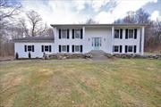 Discover this 4-bedroom, 2-bathroom raised ranch offering 2, 300 sq. ft. of living space, nestled in the sought-after Pine Bush school district. Situated on 13.5 acres of serene and private land, this home offers a perfect blend of comfort, opportunity, and natural beauty. The upper level features a bright living room, dining room, two spacious bedrooms, a full bathroom and a screened-in three-season room overlooking the private yard. The walkout lower level includes a large family room, two oversized bedrooms, a second full bathroom, and a convenient laundry area. This home has been thoughtfully updated with brand-new heating and air-conditioning split systems, new windows, a water softener system, exterior drainage, gas lines, and a Nest camera surveillance system. The first-floor flooring has been removed, offering a blank canvas to customize with your preferred materials. Set back from the road, this property offers exceptional privacy and stunning views of nature and wildlife. Enjoy the convenience of a two-car garage and a location close to hiking trails, wineries, farms, restaurants, and shopsâ€”all while benefiting from low taxes. This property is an opportunity you donâ€™t want to miss. Schedule your showing today and make this beautiful home your own!