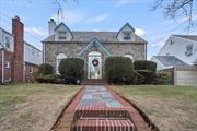 Own a piece of history!!! Welcome to this beautiful cape home once owned by the â€œFirst Lady of Song, Ella Fitzgeraldâ€. This English style cape landmarked home is situated on a 4, 000 sq ft lot. The exterior facade is adorned with brick and stone with a slate roof and walkway. It features 4 proportioned beds and 2.5 baths, living room with a wood burning fireplace, formal dining room. Finished basement with a bar-great for entertaining. The driveway can fit 4 cars, 1 car garage and a secluded backyard. The neighborhood is one of the most coveted Landmark communities in New York, Addisleigh Park.