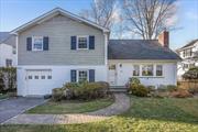 This well-maintained and charming split-level home is located on a quiet street in Scarsdale&rsquo;s desirable Greenacres neighborhood and features an expansive level yard, a rear brick patio, and an attached garage. Enter from the front door into a bright and sunny foyer with the living/dining room to the right. Large windows in both the living room and the dining room bathe the house in natural light. Straight ahead is the eat-in kitchen with stone countertops, and sliders to the patio and yard. The second floor bedroom level includes 3 generously sized hall bedrooms, a primary suite with a bath and private office as well as plenty of closets and additional storage. The lower level includes a family room, bedroom and half bath with access to the garage as well as sliders to the yard and patio. The lowest level is approximately 600SF of finished storage and includes laundry and utilities with a walkout to the yard . Walkable to the Greenacres elementary school and Hartsdale&rsquo;s train, shops and restaurant.