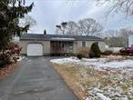 Discover the potential of this 3-bedroom, 1-bathroom home located in the heart of Shirley, NY. Offering a spacious kitchen with propane cooking, living room, and dining room with a breezeway leading to the backyard, this property provides a solid foundation for your vision. Central Air System.The home also features a full basement with walk-out access and a 1-car garage, sitting on a level quarter-acre lot. Conveniently located in the William Floyd School District, itâ€™s close to parkways, shopping, and the train station, making commuting and errands a breeze.