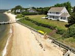 Surprisingly larger than it looks! Value, Location and Style adorn this Rare Sunset Waterfront Green Lawns Gem on gorgeous Shelter Island. Available after 100 years of property ownership. The 190&rsquo; of Silver Beach waterfront is fully bulk headed with dock on a level acre with generous side lawn. Perfect for entertaining or escaping as it&rsquo;s surrounded by mature landscaping. Reich Eklund custom built this jewel of a beach house in 1985 and it is well designed and has been maintained by one owner. All rooms have waterviews including main, living , dining and bedrooms have waterviews from 2 or 3 sides all facing the magnificent waterfront sunsets and sea breezes. This Nantucket Shingle Classic with room for pool has 5 waterview bedrooms (2 en suite) 3.5 baths, full waterside balcony, boasts an open floor plan, 2 car attached garage, scullery/laundry room and full basement with poured concrete foundation with outside bilco door entrance. If you are searching for a carefree, relaxing and magical lifestyle on big waterfront. This might very well be it!