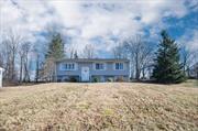 Welcome home to this charming, bright and beautiful Raised Ranch located atop Everett road in Carmel, NY on a half acre of land that backs up to a private Golf Course. Some home features include 3bds, 2 full updated baths, fully finished walkout basement new flooring & a large back deck for entertainment. Upper-level boasts quality detail work in moldings, updated kitchen with new appliances & lighting, hardwood flooring, plenty of closet space, new windows/slider to deck. The lower level includes a spacious fully finished walkout basement with an additional full bath, laundry and ample storage with access to large two-car garage. Home is on town water and sewer with an above ground 275 gallon oil tank and newly installed boiler. Just minutes from town center offering dining, shopping, fitness centers & entertainment! Minutes from I-84/I-684 & Metro North Train.