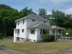 LOCATION! LOCATION! LOCATION! Walk to town and along the way visit Riverside Park across the river and fish, Hike, or just stroll along the riverbanks of the Willowemoc and Beaverkill.  This Charming 3+BR 2B 2 story Sears and Roebuck house was built in 1935, has original woodwork, hardwood floors that were all recently redone bringing back its original glory. There is an enclosed heated front porch, Two full baths one with laundry room, one on each floor, Scuttle access to attic, Livingroom, Dining room, Den (Which can also be a bedroom) Eat in Kitchen. Full walk out basement with poured floor, 500 gallon above ground oil tanks, Root cellar. Great level backyard. Garden Shed/garage. Walk to town, plenty of eateries, Do Good Distillery,  Close to NYS Route 17. Minutes to Roscoe Mountain House, Golf, Bethel Woods Performing Arts Center, Kartrite Water Park and Casino,  Holiday Mountain. 2 Hours from NYC. Come find out why everyone is moving to the Catskills!!