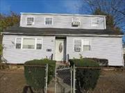 This 6-bedroom, 2-bathroom Cape-style home in West Babylon. For a buyer with a vision and the budget to undertake a renovation project, this home could offer significant returns. Once updated, the property could appeal to large families, multi-generational households, or even investors looking for rental income, particularly if you complete the conversion to a two-family home.