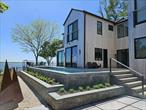 Brand New Modern Zen Bayfront, IG Pool, Right On The Beach!Like No Other. Stunner brand new construction Modern Beauty sited right on an open bay sandy Beach. One of the finest and extraordinary new build waterfront homes on the entire North Fork. The location will amaze you, your own sugar sand beach right at your door step to enjoy your favorite water sports, sunrise and sunsets. The deep property off the road is secluded, with huge open views from all rooms of a scenic bay cove to the south-east. An expanse of natural habitat acres with no other homes in sight. Peaceful sanctuary, embracing serene living. Fabulous 35 X 9 heated gunite pool, spacious decking surrounding 3 sides, waterfront balconies, intimate sunken patio with firepit, and supersized cedar outdoor shower with sun and star views. Living space floor to ceiling walls of glass give the illusion of floating on the bay, luxury high end appointments throughout. New chic designer furnishings are always arriving and add to the appeal. The main floor is flowing open great room with breathtaking views all day and night. Sleek showhouse chef&rsquo;s kitchen is roomy space for all your entertaining and meal collabs. The romantic primary suite encompasses the full south wing along the bay with its own sunbathing balcony, kitchenette, lounge area, and oversized walk-in closet. All 3 generous sized bedrooms are sunny en-suites. All 4 bathrooms in the residence are full and spa like to pamper yourself. The lavish primary bathroom provides a luxurious retreat and accommodates a slipper soaking tub, enormous shower, double sinks and a discreet water closet. Guest suites are both located on the south-east side, also with water views, one has a balcony. There is a huge family room along the central outdoor dining deck and it is poolside. This special residence will be your repeat summer go to getaway. Several trendy and delish restaurants are only minutes away, as are several award winning vineyards. Art galleries, shopping, tennis, the Hamptons are all quite close by. June $29, 000; July $46, 000; August thru Labor Day Tues 9/2 $49, 000; September $38, 000. RP# 25-321