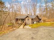 Discover the charm of this cozy 2-bedroom, 1-bathroom ranch-style home nestled in Putnam Valley. This property offers 1, 425 square feet of living space and is situated on 1.22 acres with an additional adjacent lot for a total of 2.35 acres of private, wooded land. The property features a Standby Generac propane powered generator, providing reliable power to the entire house when needed.Step inside to find a bright and inviting living space. The dining area and living room are surrounded by windows and skylights, allowing for plenty of natural light. The open layout offers a blank canvas and a solid foundation for adding your personal touch. Located in a desirable area, this property offers a great opportunity for those looking for a peaceful setting with great potential.Schedule a viewing today and envision your future at 38 Trail of the Hemlocks.