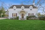 Step into this timeless colonial-style home, featuring five bedrooms and four and a half baths. The elegant design include an expansive Eat in kitchen a formal living room, a dining room, and a cozy den with views of the spacious backyard. Nestled in the pestigious back area of Lawrence, this home sits on over an acre of beautifully landscaped property, complete with a stunning pool and low taxes.