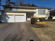 Welcome to 12 Schuyler Drive, located in West Birchwood in Jericho.  Step inside this sunny & bright Hi-Ranch home with southern exposure. Newly refinished wood floors, expanded living space & lots of room for family, friends & entertaining.