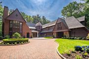 Welcome to this exceptional 10, 500 sq. ft. estate, located in the heart of Upper Brookville, New York. Fully redesigned in 2023, this custom Gold Coast residence showcases extraordinary craftsmanship and attention to detail throughout. Inside, youâ€™ll find thick-cut millwork, stained glass windows, round-top doors, coffered ceilings, and hand-carved staircases that highlight the homeâ€™s unique character. With 7 bedrooms and 7.55 bathrooms, this estate features spacious formal entertaining areas, elegant stone gas fireplaces, and a sunlit eat-in kitchen. The kitchen boasts marble countertops, a Butlerâ€™s Pantry, high-end Viking and True appliances, and a cozy round breakfast nook filled with natural light. The primary suite offers high ceilings, an expansive walk-in closet, and a luxurious marble en-suite bathroom with His & Herâ€™s vanities, a freestanding soaking tub, and a separate glass-enclosed shower. The exterior is a stunning example of North Shore architecture, constructed with brick, stone, slate, and cedar shake. Set on over 5 acres, the property features a private electric gate, Porte Cochere, a 4-car attached garage, and impeccably landscaped grounds. Outdoor amenities include a heated saltwater pool and spa, a built-in firepit, and a detached poolside cabana with a newly designed center-island kitchen. This estate blends timeless elegance with modern luxury, making it a truly distinctive offering in Upper Brookville.