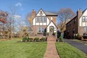 This Luxury Tudor Style Home Situated on a Desirable Corner Property in the Prestigious Lynbrook School District 20 Showcases Unparalleled Elegance and modern upgrades. Sitting on a Spacious Double Lot, The Recently Renovated home Boasts Superior Craftsmanship and Premium Finishes Throughout. The Exterior Features a New Roof With a 25-Year Warranty and Upgrades 200 amp Electrical Service. Inside the Meticulously Designed Kitchen Offers White Shaker Cabinets With Soft-Close Functionality, Premium Quartz Countertops, Porcelain Flooring, and Top-Tier Stainless Steel Appliances With Warranties. The Formal Dining Room Exudes Sophistication, With New Wainscoting and a Dazzling Crystal Chandelier. The Full Bathroom is Equipped with Imported Marble Tiles. Both Bathrooms Include High-End Fixtures and Smart Toilets/Bidets For Added Luxury. Throughout the Home, Upscale Woodwork and Modern LED Lighting Create a Cohesive and Refined Ambiance. The Wood/Gas Burning Fireplace Has Elegantly Been Updated With New Stonework and Doors, Adding Warmth and Character to The Living Space. Additional Features Include a Charming Sunroom. aGarage, and a Driveway accommodating Up to Four Vehicles. The Restored Hardwood Floors and Exterior Woodwork Maintain the Home&rsquo;s Original Charm. This Exquisite Property Offers Convenience and Luxury, close to all Essentials and Amenities.