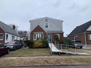 Beautiful Expanded Cape House With 4 Bed Room, And 3Full Bath, Full Finished Basement and OSE, Gas Heating. This home has undergone numerous updates, including a laminate flooring installation in the basement (2025) and a full window replacement (2024) with energy-efficient, noise-reducing windows featuring heat-reflective glass and advanced security features. Other exterior upgrades include custom seamless gutters, wide downspouts, and insulated entry doors with high-end finishes. The property also boasts a wheelchair-accessible ramp at the front entry, a renovated second kitchen (2023) with new stainless steel appliances, Corian counters, and porcelain tile flooring, as well as multiple renovated bathrooms, including the main floor (2022), basement (2021), and upstairs (2019). Other notable features include a 40-gallon hot water tank (2014), Weil McLain boiler, Dormered garage , PVC privacy fence, and an enclosed yard perfect for pets. The home offers convenient access to major highways, public transportation, and top hospitals like LIJ, Northshore, and NYU Langone, as well as being located in School District #26. With a 3-car driveway, private second-floor entrance, and ample closet space, this home is a rare find. Listed at $1.3M!