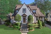 Charming 1920s Tudor in the heart of Scarsdaleâ€™s Greenacres, just a short walk to the train, schools, and shops. This sun-filled home welcomes you with a spacious entryway featuring a powder room, large closet, and room for a bench or entry table. The generously sized living room includes a cozy fireplace and opens to a covered porch, offering seamless indoor/outdoor living. A formal dining room flows into the kitchen, which boasts a separate area perfect for a breakfast nook. The first floor also includes a versatile office/den with an ensuite full bath, with possibility to convert into a fourth bedroom. Upstairs, you&rsquo;ll find three spacious bedrooms and two full bathrooms. The primary bedroom boasts an expansive scenic view of the area. The partially finished basement provides a recreation space, laundry area, and large storage room, offering potential to create a larger finished area. The level, well-sized backyard is accessible via a side door off the kitchen or from the covered porch, perfect for outdoor entertainment and play. Updates include new sprinkler system and roof less than 15 yrs old.