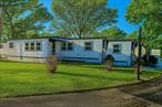Welcome to Riverhaven 55+ Community! Must be 55+ & Cash Only Purchase. This Home Has Updated Electric In 2018, Double Pane Windows From 2019, Furnace From 2022, Updated Bathroom, Skirting Recently Replaced, Mini-Splits For Heating & Cooling Installed In 2022, And New Vinyl Floor Installed. Bonus Flex room with CO from town and is considered a legal fourth bedroom on paper but can have multiple purposes. No Pets Over 40 lbs. Taxes Are Low. Rent Includes Lease of Land, Water, Cesspool, Trash & Snow Removal. To Be Qualified You Must Have A Credit Score of At Least 650 And An Income of At Least $2, 000/month. Being Sold As-Is. Close and convenient to stores, restaurants, park, transportation, Down Town Riverhead. Also access to private beaches through the community.