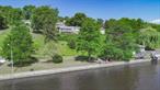 Rare Opportunity on the Hudson River with Over 250 Feet of Unmatched Waterfront Access and a 3, 400 square foot MCM home! Discover a once-in-a-lifetime chance to own an extraordinary property boasting over 250 feet of pristine Hudson River frontage, free from any obstructive railroad tracks. This unique parcel features a concrete river edge/seawall that cannot be replicated, offering a concrete boat ramp, two lifts, and unparalleled water access. The expansive, flat land along the seawall provides an ideal setting for waterfront activities, from leisurely riverfront strolls to hosting large-scale outdoor gatherings. This exclusive location is a true gem, offering breathtaking views of the Hudson River from every vantage point on the property. Whether you&rsquo;re relaxing or entertaining, the spacious, grassy waterfront area is perfect for enjoying the serene beauty of the river or even accommodating guests arriving by helicopter from NYC. Conveniently situated just minutes from Kingston&rsquo;s attractions and a short drive to I-87, Amtrak in Rhinecliff, or Metro North in Poughkeepsie, this property offers both seclusion and accessibility. Enjoy dining at a multitude of restaurants within a 10-minute drive or explore nearby hiking and biking trails such as the Walkway on the Hudson, Shaupeneak Ridge Park, and Kingston&rsquo;s extensive rail trail, all within a 10-15 minute reach. Don&rsquo;t miss the opportunity to own this spectacular property with fantastic river frontage and unparalleled access, perfectly blending luxury, convenience, and natural beauty. Additional Information: Amenities:Marble Bath, ParkingFeatures:2 Car Detached,