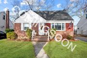 Expanded Updated Cape in the heart of Merrick. New Kitchen, huge den extension, new gas heating system & new baths. Doors off den into nice size fenced in yard. School bus stop on corner across the street for Elementary School.  Seconds to shops, dining & LIRR.