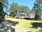 Westhampton Beaches Suffolk Pines is the East Ends most affordable housing community - with extremely low taxes and reasonable monthly lot rental. This unit is the parks best spot on the corner with nearly a double wide lot. Plenty of yard space, parking on site and out front unlike any other. It has a rare 3 bedrooms and 1 1/2 bath - a plus. This is a Fully updated Mobile Home with New Kitchen, Stainless Appliances. New Floors, Paint,  Deck and Outdoor Shed. Minutes to Westhampton Beach Village and Ocean Beaches. Enjoy an affordable Summer Location or Family Friendly year round living. No age restrictions.