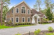 Summer in this lovely home situated in the Ice Pond Estates area of Quogue Village. Enter into a grand open living room with 2 seating areas, a large dining area that seats up to 10 adjacent to the enormous open kitchen. The kitchen was renovated in 2021 and includes a 48 Viking stove with 2 ovens and 2 Miele dishwashers, under-counter wine fridge, with an island sink and a Sub-Zero refrigerator. There are 3 bedrooms on the first floor, the first bedroom is en-suite with a newly renovated full bathroom and soaking tub with separate access to the heated pool and patio. The second and third bedroom share another newly renovated bathroom. Also on this floor is a full laundry room. The second floor includes a spacious primary suite and a family room/den/office with an en-suite full bathroom. The large patio and 18x36 heated pool is surrounded by a lovely planted garden with southeast exposure. The home is adjacent to the Quogue Wildlife Preserve. Village shops and Quogue Village Beach are minutes away.