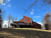 A peaceful setting, close to NY Fahnestock State Park&rsquo;s 14000 acres and hiking trails of the Appalachian Trail, this modern home is bordered by marshlands and beaver pond. It offers a separate detached (unfinished) workshop near the modern style home. Rear decking overlooks the marshes and allows for bird watching and tranquility, while offering significant outdoor seating & entertaining area. An interior open floorplan offers high-story windows, solid wood doors, pine and hardwood floors, a layout which also offers an added den plus a separate office in addition to the 2 bedrooms and 2 baths. Bring your imagination and creativity to update this special property in the Garrison School district, and enjoy the special features this home and its privacy allows for.