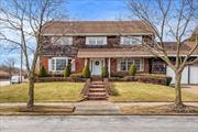 This stunning oversized colonial, set on a desirable 80x100 corner lot, offers timeless elegance and spacious living. Step through the beautiful foyer into a home designed for both comfort and entertainment. Featuring a formal living room, a formal dining room, and a large kitchen, this home also boasts a bright sunroom with an indoor grill and a massive den perfect for gatherings. With high ceilings, 3 generously sized bedrooms plus 2 rooms that can be used as additional bedrooms or an office/den. Complete with a full attic, and a full basement, thereâ€™s no shortage of space. Complete with a two-car garage, this property is a must-see!