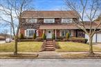 This stunning oversized colonial, set on a desirable 80x100 corner lot, offers timeless elegance and spacious living. Step through the beautiful foyer into a home designed for both comfort and entertainment. Featuring a formal living room, a formal dining room, and a large kitchen, this home also boasts a bright sunroom with an indoor grill and a massive den perfect for gatherings. With high ceilings, 3 generously sized bedrooms plus 2 rooms that can be used as additional bedrooms or an office/den. Complete with a full attic, and a full basement, thereâ€™s no shortage of space. Complete with a two-car garage, this property is a must-see!