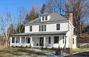 Offering the perfect marriage of classic design and modern amenities only 3/10 mile from the historic village of Katonah (Town of Bedford) and its Metro-North train station, this charming five bedroom, four and one-half bath 1910 farmhouse awaits on 2.2 landscaped acres at the end of a long, gracious approach. This 3, 100 square-foot local landmark has been meticulously restored inside and out, with a reimagined layout featuring high ceilings, original details, hardwood floors, a first-floor bedroom and more. The sun-drenched interior with gracious foyer and original banister/railings features all-new electric, plumbing, and heating systems; high-end chef&rsquo;s kitchen with Bosch refrigerator and dishwasher; duel fuel 48-inch range (propane/electric), microwave; bright spacious dining and living rooms; new bathrooms; laundry room, mud room, and more. Walls installed with spray-foam insulation throughout, the exterior of the home with classic front porch is clad in Hardieplank lap siding, Anderson 400-series thermal windows, and a new roof. All of this with high-efficiency Bosch heat pump 6-zone heating system, on-demand hot water, and fire/burglar/carbon monoxide alarm system, motion sensor security lighting, pre-wired for both exterior camera system and whole-house generator, offering the best of both worlds -- historic charm with comfort, convenience, security, and energy savings. The property has drainage installed and a newer shed built on the stone foundation of a former barn; there is room for a pool and garage. In addition to top-tier medical care and hospitals nearby, the village of Katonah offers a myriad of cultural and recreational opportunities, including the Katonah Museum of Art, renowned Caramoor Center for Music and Art, a multitude of parks/preserves, including nearby 4, 700-acre Ward Pound Ridge Reservation for hiking, camping, X-C skiing, nature programs and more. Located in the award-winning Katonah-Lewisboro School District with nearby private school options, this gracious landmark is under one hour from New York City.