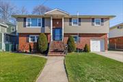 This spacious two-family high ranch in the heart of Franklin Square is a gem! Each unit is well-maintained, featuring a large finished basement with a separate entrance to the backyard. The first-floor unit includes one bedroom, an updated kitchen and bath, a den and living room, ample closet space, and a huge pantry. The second-floor unit boasts a primary bedroom en suite, two additional bedrooms, a formal dining room with sliding doors leading to a deck, a spacious kitchen, and a large living room. The fully finished basement offers plenty of storage, a recreation room, and laundry facilities, with easy access to the backyard.