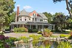 Welcome to this Classic, thoughtfully maintained and updated Queen Anne Victorian in historic South Bayport. Built in 1860 and situated on 1.7 impeccably landscaped acres of gated property, this private oasis offers space and tranquility to enjoy at the end of a busy day. Enter the secure gates and be transported to elegance and refinement. A new paver driveway rolls up to the front parking circle. From the expansive wrap around porch, you&rsquo;ll enter into a timeless grand entry foyer that displays some of the most beautiful craftsmanship in hand carved oak woodwork on the coffered, hand painted ceilings, built in bench and custom railings. Intricate medallions and Tiffany-style stained-glass windows showcase the artistry of the Victorian era. A formal living room with rare floor to ceiling windows of curved glass will impress and a substantial wood burning fireplace offers a cozy place to entertain guests. Original diamond glass doors welcome you to the formal dining room with wood burning fireplace and tons of light, custom faux painting and access to the adjacent solarium, complete with original paned windows that envelop the porch. A wonderful place to retreat after dinner and enjoy the stunning views of the gardens and pool. Work from home is no issue when you have an office complete with granite topped desk, connectivity and privacy and an originally tiled gas fireplace. The custom kitchen will not disappoint for the culinary inclined! Custom cabinetry, granite countertops, Sub Zero, DCS, and Kitchen Aid Stainless appliances serve every cook&rsquo;s needs and opens to a bright breakfast area and Family Room with vaulted ceilings, sky lite and adjacent powder room and laundry room. The Primary Suite on the second floor is nothing short of a retreat. A spacious room with more of those stunning curved windows and wood burning fireplace create a serene ambiance where the marble primary bath with oversized steam shower and Jacuzzi tub help to relax and unwind. There is also an expansive, custom walk-in closet. A sunny Library at the end of the hall, complete with wood burning fireplace and fabulous windows is a great place to read or enjoy games with friends and family. You can access the front balcony from here to survey the expansive, exquisitely landscaped grounds. This home perfectly balances modern convenience with antique allure. Whether you envision vibrant gardens, outdoor gatherings, or simply wish to enjoy the peace of your own private retreat, you can find it here. Outdoors, an oversized Trex deck with DCS built in gas grill/granite kitchen take you to the recently renovated pool, Gazebo and Covana automatic covered Jacuzzi/Hot Tub. There is a separate, 3.5 car Garage/Carriage house with second floor storage and a dog run for our best friends to enjoy!  Updates include: custom low voltage lighting for driveway, landscaping and house facade, full surveillance camera system, Nicolock driveway, automatic security gates, LeafGuard gutter system, 14 zone sprinkler, CAC, heating, 400 amp service in house and 50 in garage, exterior sound system, roof updated and replaced, central station fire/burglar alarm system, 18 x 30 IG pool refinished, new liner, Loop Loc cover and variable speed pump, whole house water filtration, new garage doors + openers. This home has been featured on the HGTV shows like If These Walls Could Talk, adding to its storied history. Step into a world where history and luxury coexist beautifully and don&rsquo;t miss your chance to own this true masterpiece near Long Island&rsquo;s Great South Bay. Close to shopping and restaurants, downtown Sayville and South Shore beaches and Fire Island Ferries. 25 minutes to Stony Brook Medical Center, 20 minutes to Northwell South Shore University Hospital, 25 minutes to Catholic Health/Good Samaritan Hospital, 1.5 hours from NYC/LIRR.