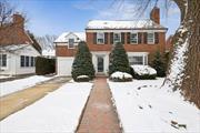 Welcome to this lovely 1938 Garden City Estates brick colonial by Architect Olive Tjaden. Known for her charming architecture, wonderful use of space and timeless aesthetic. Four bedrooms on 2nd floor with ample closets, and 2.5 bath home embodies elegance and warmth. A gracious living room with traditional wood burning fireplace flows seamlessly into a spacious and sunny dining room, adjoin an updated bright EIK as well as an inviting family room both overlook a slate patio and backyard with lovely gardens. Perfect for both relaxing and entertaining. The terrific lower level with high ceilings and walkup third floor attic offers a tremendous amount of Bonus Space for recreation, storage and home office. A perfect blend of historical character and modern updates. Tremendous updates include the entire Vermont slate roof completely redone (6yrs), high efficiency CAC & 2 zone Weil-McLean Steam and HW boilers, Low taxes, $17, 722. this home is exceptional opportunity.