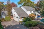 Spectacular One Of A Kind Home & Location For This Breathtaking Contractor&rsquo;s Own 4659 Square Foot Post Modern Home With All High End, Top Of The Line Custom Details & Finishes On A Private Flag Lot Just Steps From The Pathway To A Private Long Island Sound Beach (Association Dues Are $400 Per Year) In The Beautiful Sought After Sunset Bluffs Community In Miller Place (Also A Perfect Second Home/Summer Getaway With It&rsquo;s Private Location & Proximity To The Beach). All Top Of The Line, Exquisite Features & Upgrades, A Stylish & Sophisticated Home Designed For Both Indoor & Outdoor Living/Entertaining Offering An Elegant, Spacious Open Floorplan - Greeted By A Two Story Entrance Foyer With An Open Stairway, All Custom Woodwork/Trim & Large Circle Topped Window, Magnificent Great Room With 30&rsquo; Ceilings, Showcase Focal Point Two Story Fireplace With All Carved & Inlaid Marble, Circle Topped Windows, Hand Painted Faux Finished Walls, Hardwood Floors & Triple Andersen Doors To A Deck & Backyard, Breathtaking Sunroom With Glass Multipanel Walls & Ceilings, Double French Doors To A Deck Overlooking The Pool & Marble Tiled Floors. The Magnificent Chef&rsquo;s Kitchen Offers Stunning Custom Cabinetry, Beautiful Custom Moldings, Details & Trim, Expansive Granite Countertops/Serving Areas, Italian Copper & Marble Farm Sink, Two Separate Barstool Areas, Five Star Stainless Steel Range With Six Burners, Grill & Two Separate Ovens (One Gas & One Electric), Cherry & Oak Hardwood Floors With Accent Mosaic Tile Inlays, And A Stunning Custom Bar With Arched Brick Walls, Beautiful Accents, Granite Counters & Sink. An Additional Game Room Offers Entertaining Space Between The Kitchen & Great Room, & A Sun Filled Two Story Dinette Area Offers Room For A Very Large Table, Two Sets Of Sliding Doors To The Back Deck, All Accent Andersen Windows Above & Venetian Plaster Accent Wall. Off Of The Entrance Foyer Is A Banquet Sized Formal Dining Room (Or 4th Bedroom) With Custom Moldings, Two Large Windows With Custom Draperies & Faux Painted Walls. A Stunning Powder Room Offers A Full Cut Stone Accent Wall & Custom Cherry Vanity, & A Comfortable Den/Family Room Offers Ample Room For Furniture, A Large Andersen Window For Natural Light, Faux Painted Walls, Venetian Plaster Accent Wall & All Custom Curtains/Draperies. A Large Main Floor Bedroom, Stunning Renovated Guest Bath With Vaulted Ceilings, Skylight, Slate & Beach Glass Tiled Floor, Blue Marble Topped Vanity & An Oversized Shower, & A Side Entry 2 1/2 Car Garage (With Steel Beams - No Columns - Perfect For Auto Enthusiasts) Completes the 1st Floor. The 2nd Floor Offers Glass French Doors To A Stunning Primary Bedroom - Offering Faux Finished Walls, A Door To A Juliet Deck With Beautiful Waterviews, Ample Room For Furniture & A Large Walk In Closet With Custom Built Ins/Closet System. The Magnificent Primary Bath Offers A Sunken Jacuzzi Tub With All New Glass/Mosaic Tile, Vaulted Ceilings, Skylight, Large Separate Shower & Custom Vanity, & Off Of The Primary Bedroom Is An Expansive Loft Overlooking The Dinette Area With Two Skylights & This Could Easily Be Converted Into An Additional Primary Bedroom Suite. The Lower Level Of The Home Offers A Fantastic Game Room/Pool Table Room, Lovely Full Bathroom, Amazing Media Room, Sitting/Living Room & An Entrance To The Backyard, And Top Of The Line Systems Including A Buderus Gas Propane Heating System, April Aire Humidifier, Multiple Upgraded Electric Panels, 3 Zone Heating, 3 Zone Central Air Conditioning & A 550 Gallon Propane Tank, The Exquisitely Landscaped Property Is Wrapped In Stunning Landscape, Tall Privacy/Shade Trees & Hedges, Estate Iron Fencing & Cut Stone Lighted Columns Wrap The Dazzling Country Club Entertainment Area Offering A Hidden Pond Natural Shaped Heated Saltwater In Ground Pool, Expansive Paver Patios/Pool Surround, Accent Stone Inlays/Trim, and Multilevel Decking. The Home & Location Are Truly One Of A Kind, Spectacular & A Must See!