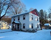 Located at the edge of the town center on about a third of an acre, this 3 bedroom, 2 bathroom colonial style home is waiting for a fresh start. The side entrance from the driveway finds a mud room and laundry room. From there youâ€™ll find a spacious kitchen attached to a nicely sized dining room. Pass through the center hall to a large living room adorned by a gas fireplace. The center hall contains a private full bathroom. Upstairs youâ€™ll find a second full bathroom, three generously sized bedrooms and an office.  What seems to be a closet in the bathroom opens up to two more bonus rooms currently used for storage but could easily be transformed for more living space. An attached, one car garage adds more storage space and entry to the basement. Boiler, water heater, oil tank and central vacuum are all updated. Septic was improved in 2017.