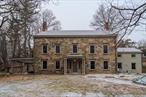 The Stonehouse. A charming and historic farmhouse rental at the Base of Schunnemunk State Park. Built in 1832, Original wide plank hardwood floors, 9ft + ceilings,  other original architectural details span the entire home. The living room has a charming Wood Burning Fireplace with access to a side-yard covered patio, Dining room has beautiful period furniture, and family room has a wet-bar tucked away.  All of the rooms are spacious rooms with large Anderson Windows, and many access the outdoors. The kitchen is brand new with Quartz Countertops and Stainless Steel appliances, and a side door to a charming flagstone patio for outdoor dining. A powder room and large laundry / pantry room is also available on the first floor.  4 large bedrooms and 4 full baths on the upper levels. 2 additional rooms on the upper levels could be office spaces, workout rooms, guest rooms or more. The third floor is a great bonus, with vaulted hand hewn post and beam features, this large space can easily become the heart of the home. A full-bath and two other rooms are on the third level.  Property borders Schunnemunk State Park, which is fantastic for hiking, snow shoeing or cross country skiing. 16 miles to Bear Mountain State Park. 47 miles to the George Washington Bridge.  Cornwall School District. Freshly painted throughout. All utilities brand new. Central AC. New Cedar Roof. New Copper Gutters. Tenant to pay all utilities and manage snow for their area and driveway only, and tenant to pay first month rent, one month security deposit. Available for move in March 1, 2025. No pets. Landlord will pay for lawn and property maintenance.