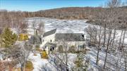 Imagine waking up each morning to the serene beauty of your own 13-acre lake â€”a rare gem that sets this property apart. This isn&rsquo;t just a home; it&rsquo;s a canvas for an extraordinary lifestyle where nature meets comfort. The setting is nothing short of breathtaking, offering panoramic lake views that soothe the soul and inspire the spirit.The house itself is a contemporary treasure, lovingly maintained and brimming with potential. While it awaits your personal touch to reach its full pristine glory, the heavy lifting has been done. Brand new Hardie board siding wraps the exterior, all-new windows flood the interiors with natural light, and updated heating and cooling systems ensure year-round comfort and efficiency.Step inside to a layout designed for both relaxation and entertainment. The first-floor master bedroom offers an intimate view of the tranquil lake, turning everyday routines into serene retreats. The main living and family rooms feature towering windows that frame the water&rsquo;s expanse, while a warm fireplace becomes the heart of the homeâ€”a perfect backdrop for unforgettable moments with loved ones.Venture upstairs to discover a unique second-floor sitting area complete with a dry bar, overlooking the living spaces below. It&rsquo;s an inviting nook for hosting friends or enjoying quiet evenings, adding a touch of sophistication to the home&rsquo;s charm.This property is more than a place to live; it&rsquo;s an opportunity to craft the life you&rsquo;ve always imagined. With significant updates already in place and endless possibilities ahead, it&rsquo;s poised to become a haven that reflects your style and aspirations. Don&rsquo;t miss out on this fantastic chance to own a slice of paradise where every day feels like a getaway.Sale includes 13.2 acre parcel (SBL: 225-2-2) with body of water known as Franz Kloiber Lake. Acreage & taxes stated in the listing are combined for both parcels.